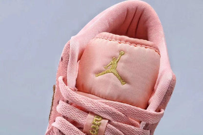 Close-up of the padded pink tongue with a gold Jordan emblem.