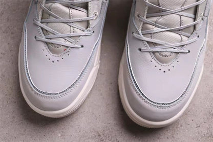 Close-up of the perforated toe boxes, laces, and layered front panels.
