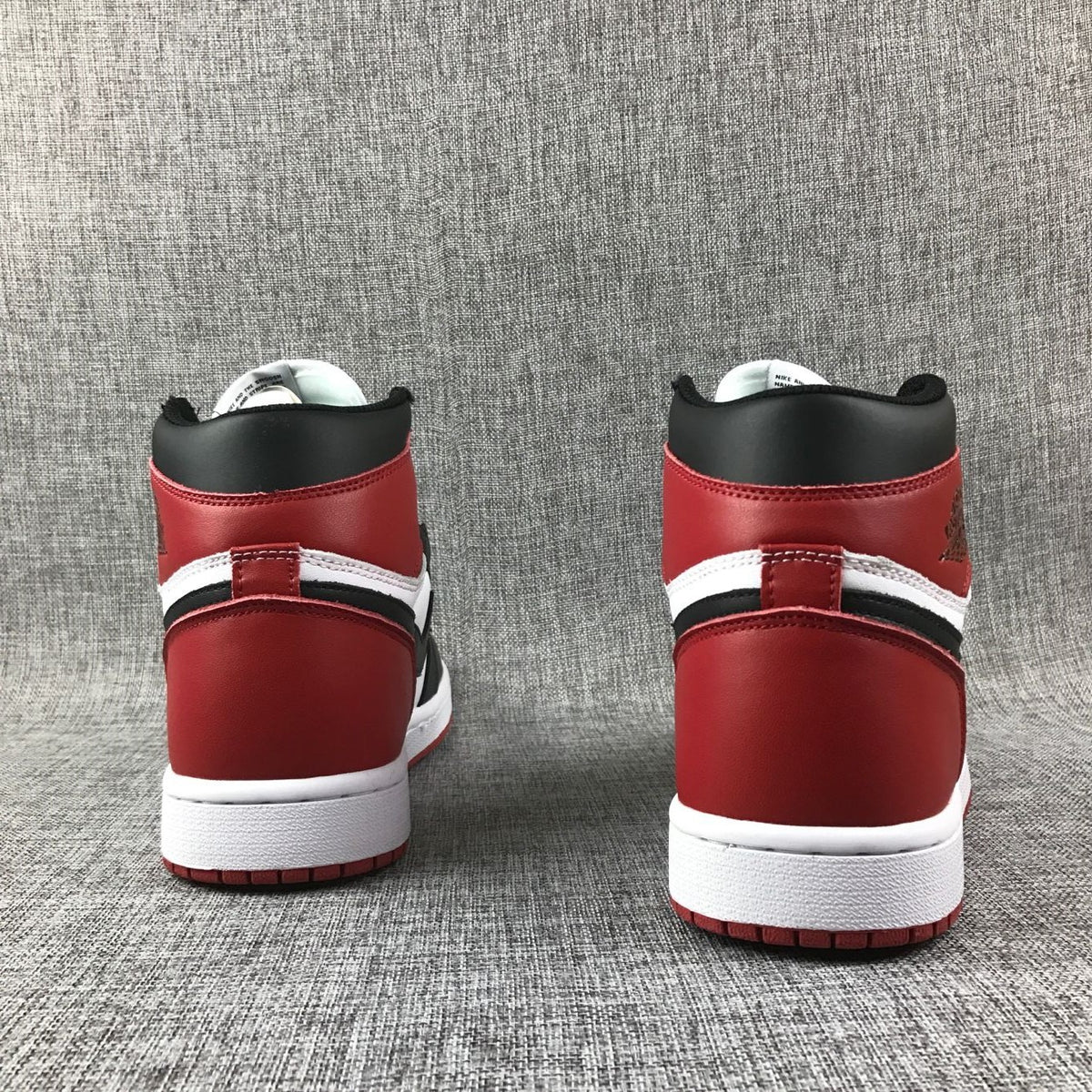 Rear view of the red and black heel panels on Air Jordan 1 high-tops