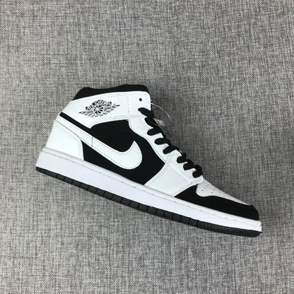 Single black-and-white high-top sneaker shown in side profile.
