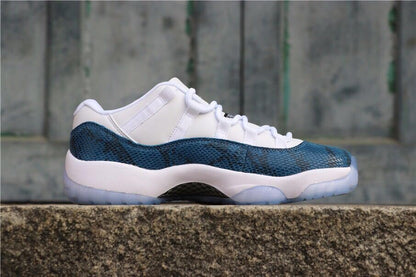 Side profile showing the navy patterned upper, white midsole, and low-top silhouette.