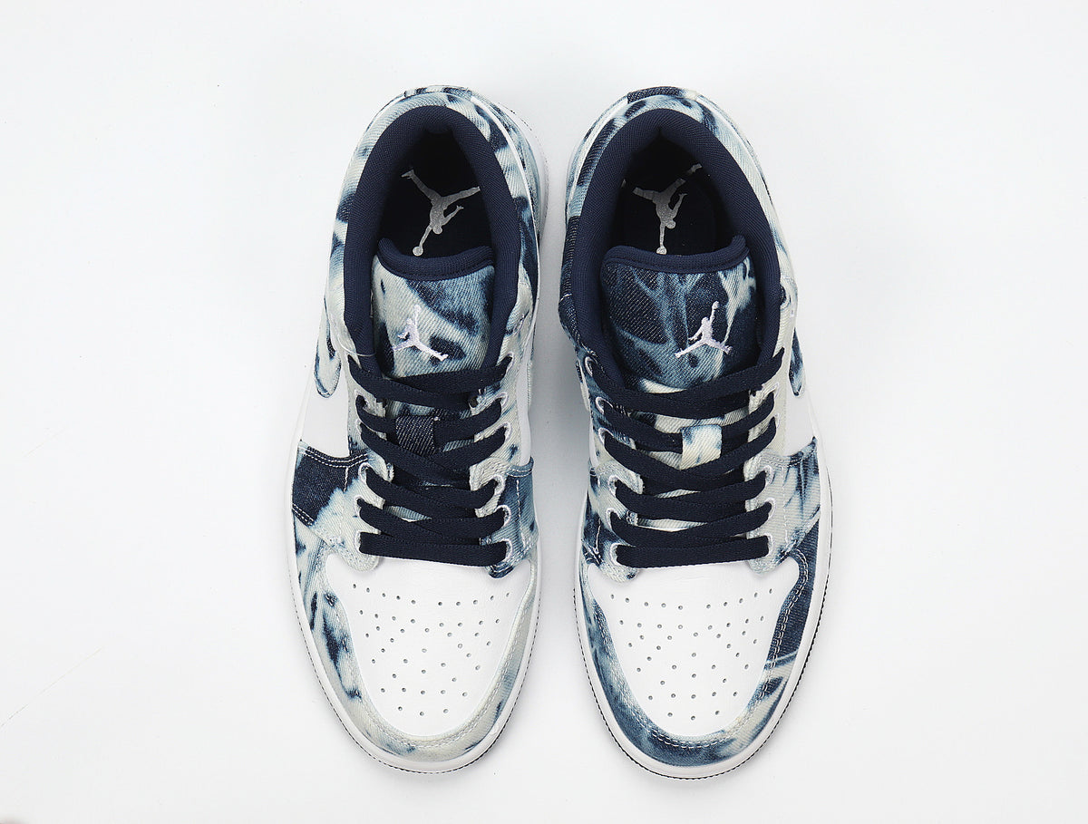 Top view showing the perforated white toe boxes, navy lining and Jordan tongue branding.