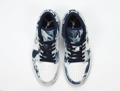 Top view showing the perforated white toe boxes, navy lining and Jordan tongue branding.
