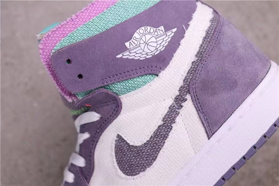 Close-up of the side panel showing the winged basketball emblem and contrasting Swoosh.