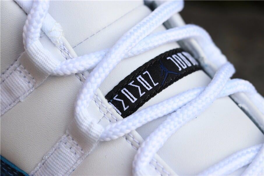 Close-up of white laces and the tongue label on the sneaker.