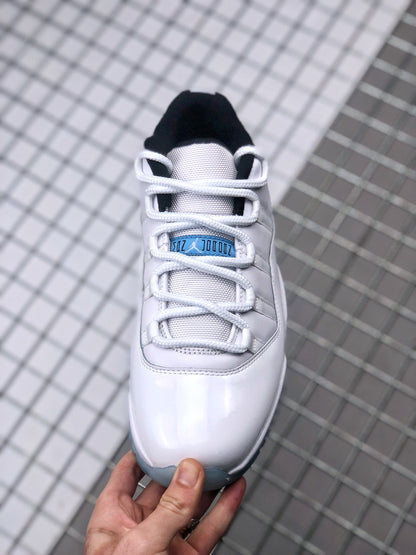 Top view showing the white laces, textured tongue, blue tongue label, and black collar lining.