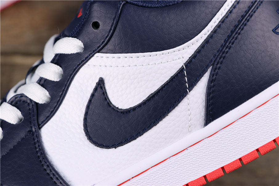 Close-up of the dark blue and white sneaker side panel, Swoosh, stitching, and white midsole with a red outsole edge.