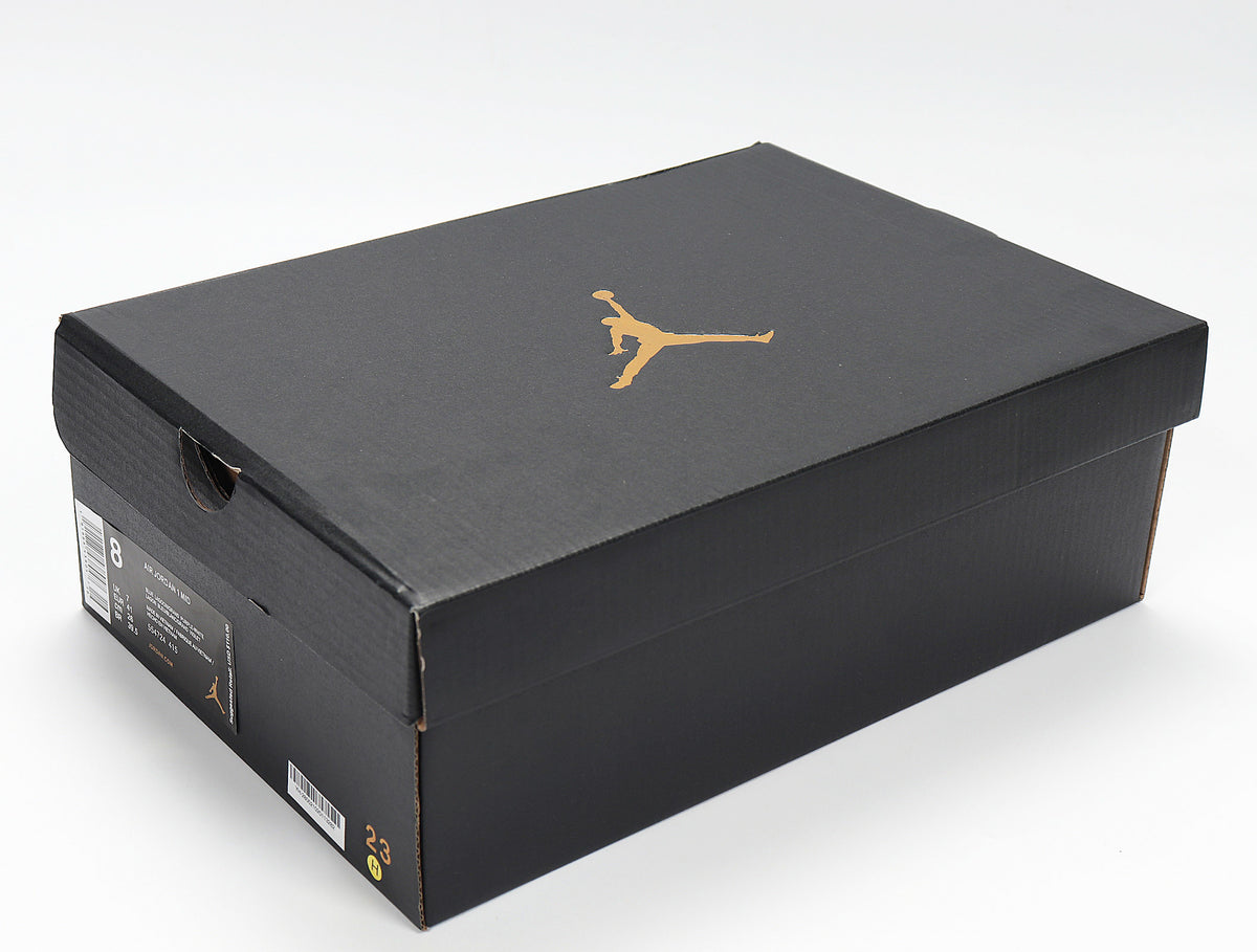 Black Jordan shoebox with a gold Jumpman logo and a visible size label showing 8.