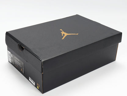 Black Jordan shoebox with a gold Jumpman logo and a visible size label showing 8.