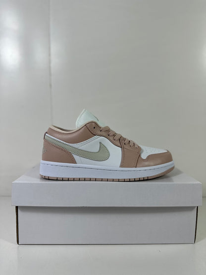 Side profile of a Jordan Air Jordan 1 Low sneaker on a white shoebox.