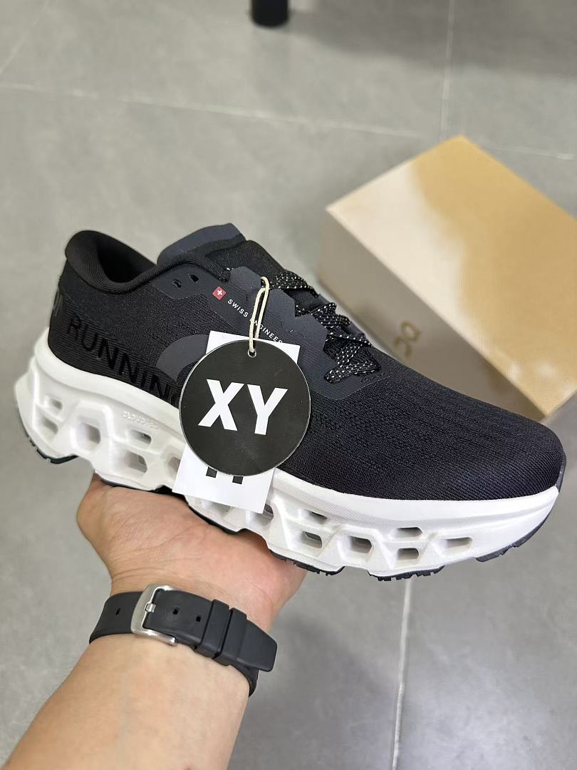 On Running Black and White Road Running Sneakers