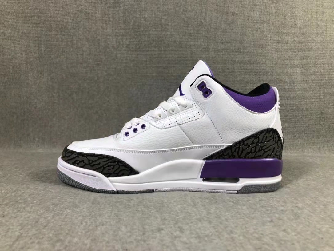 Side profile showing the white upper, dark elephant-pattern overlays, purple collar, and midsole accent.