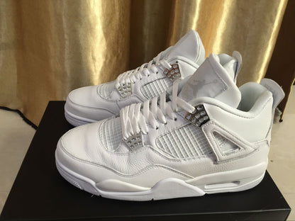 Three-quarter side view of the white sneakers highlighting the layered upper, white laces, mesh panels, and midsole window.