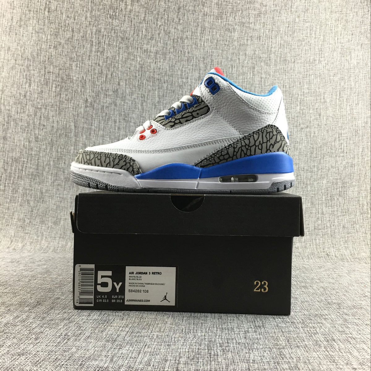 Side view of the Air Jordan 3 Retro sneaker with the box size label visible.