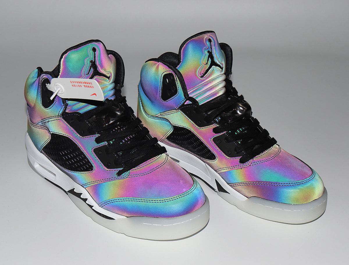 Pair of Jordan 5 Retro sneakers with a bright multicolor iridescent finish.
