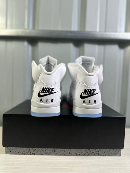 Rear view of the pair showing black Nike Air branding and translucent blue outsole edges.