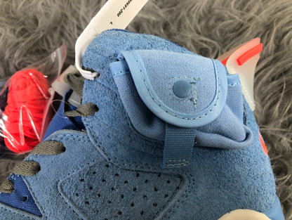 Close-up of the ankle pocket and perforated side panel on the sky blue sneaker.