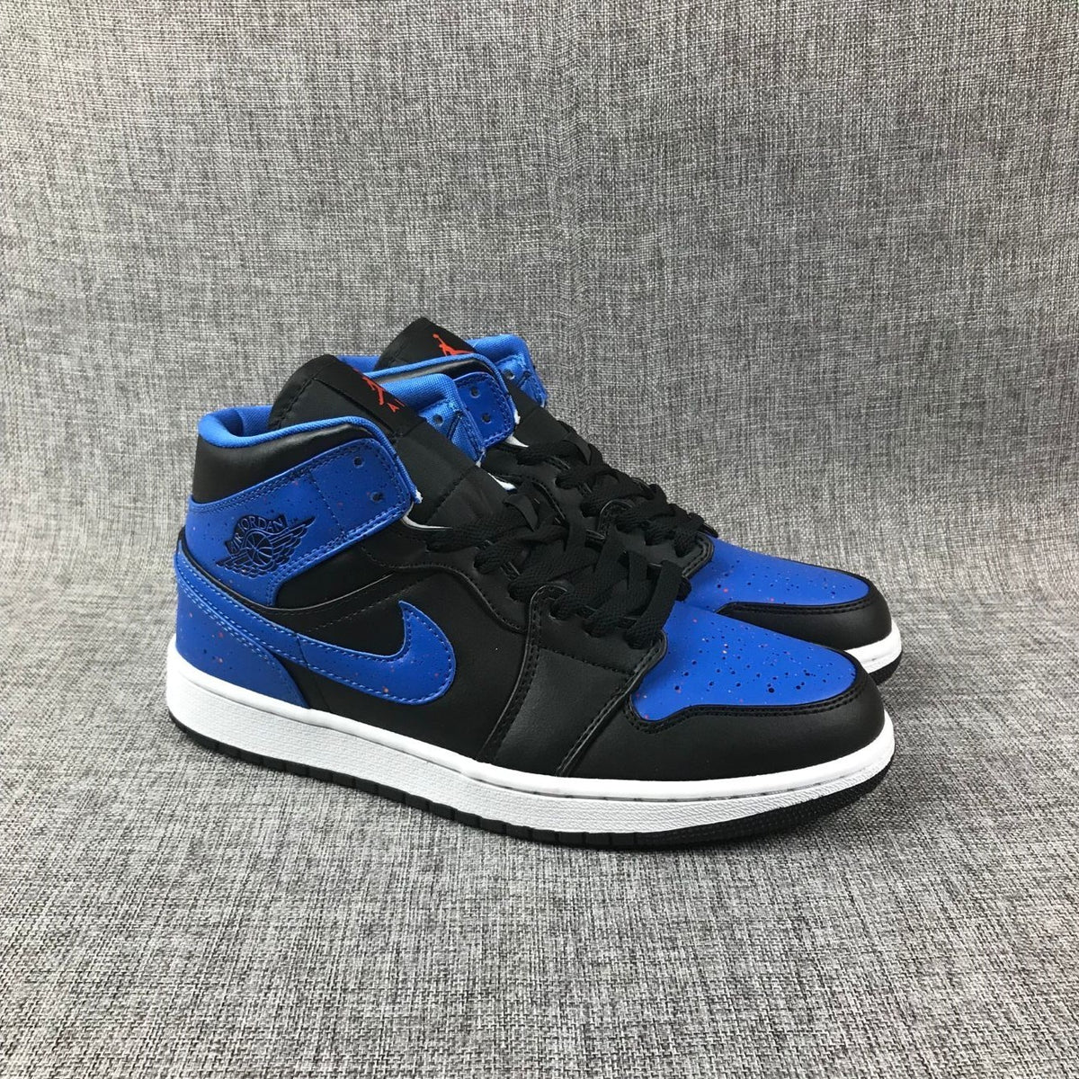 Pair of black and blue high-top sneakers shown from a front three-quarter angle.