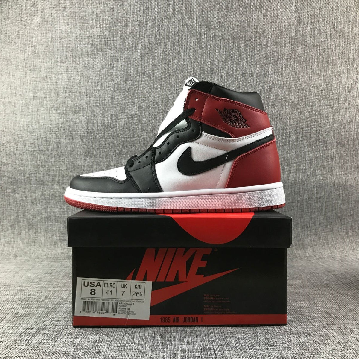 Air Jordan 1 high-top sneaker displayed on a shoe box with a visible size label