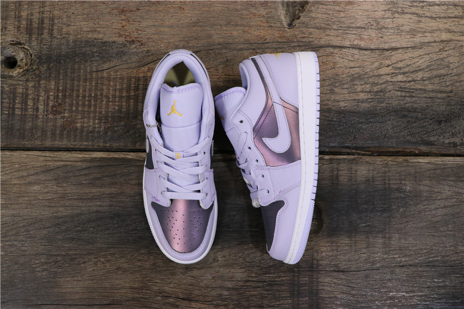 Top view of the purple low-top sneakers showing lace-up fronts, dark panels, metallic purple toe sections, and white soles.