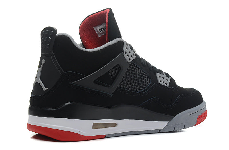 Opposite side view of the black high-top sneaker with grey midsole and red outsole accents.