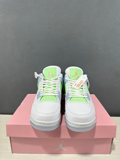 Front view of the pair showing white toe boxes, lime green tongue and mesh details, and white laces.
