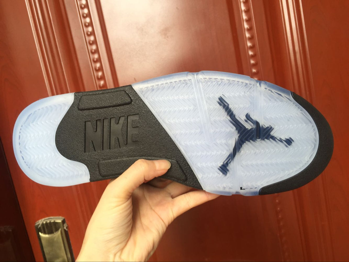 Outsole view showing translucent blue sections, black traction areas, and visible Nike branding.