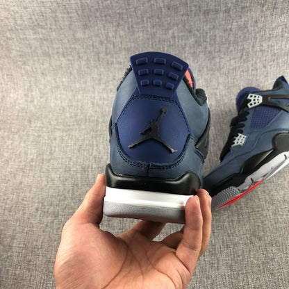 Rear view of the sneaker showing the Jordan emblem, navy heel panel, black overlay, and white midsole.