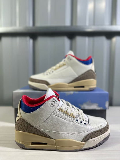 Close angled view of the textured white upper, patterned overlays, and colored collar accents.