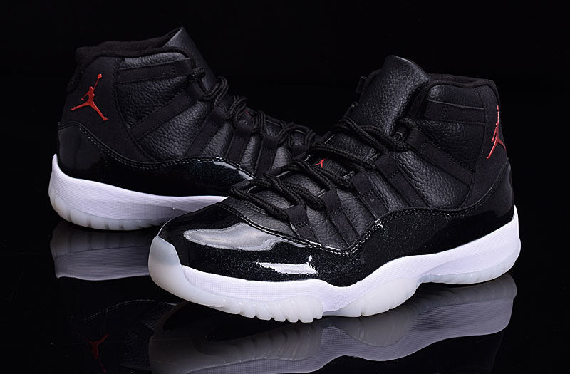Pair of black high-top sneakers with glossy black paneling and translucent white outsoles.