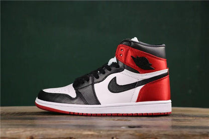 Opposite side profile showing the black toe overlay, white quarter panel, red heel, and red outsole.