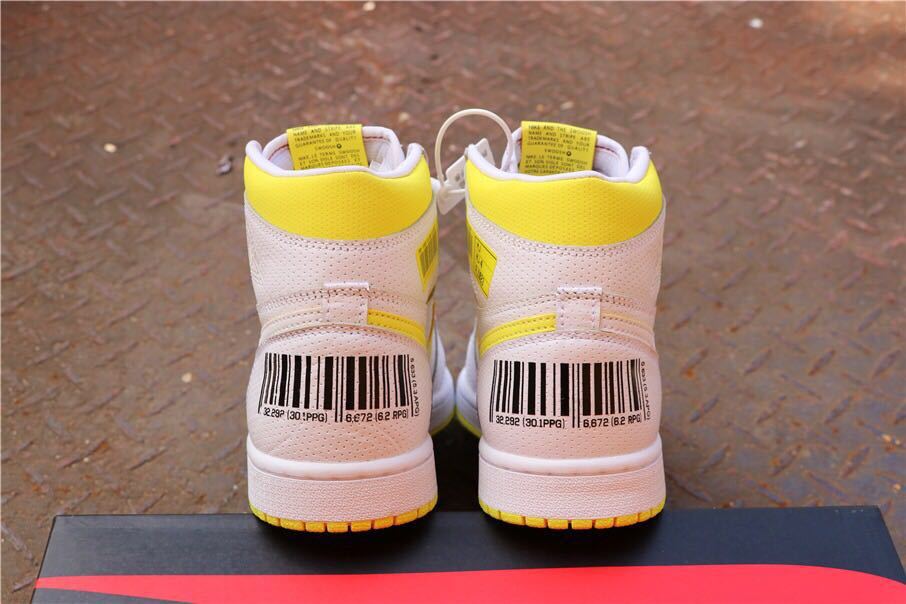 Rear view of white and yellow high-top sneakers with barcode-style heel graphics.
