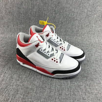 Front three-quarter view of the pair with white laces, red collar accents, and gray panels.