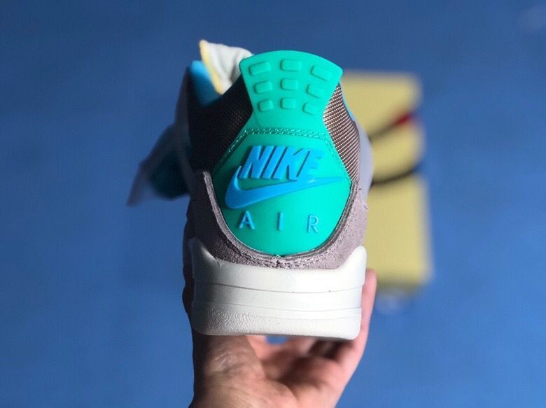 Rear view showing the teal heel tab with raised Nike Air branding.