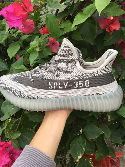 Side profile showing SPLY-350 lettering, the contrasting stripe, and the translucent ribbed sole.