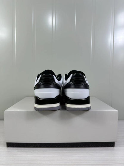 Rear view showing black padded collars, black heel panels, white heel sections, and gray outsoles.