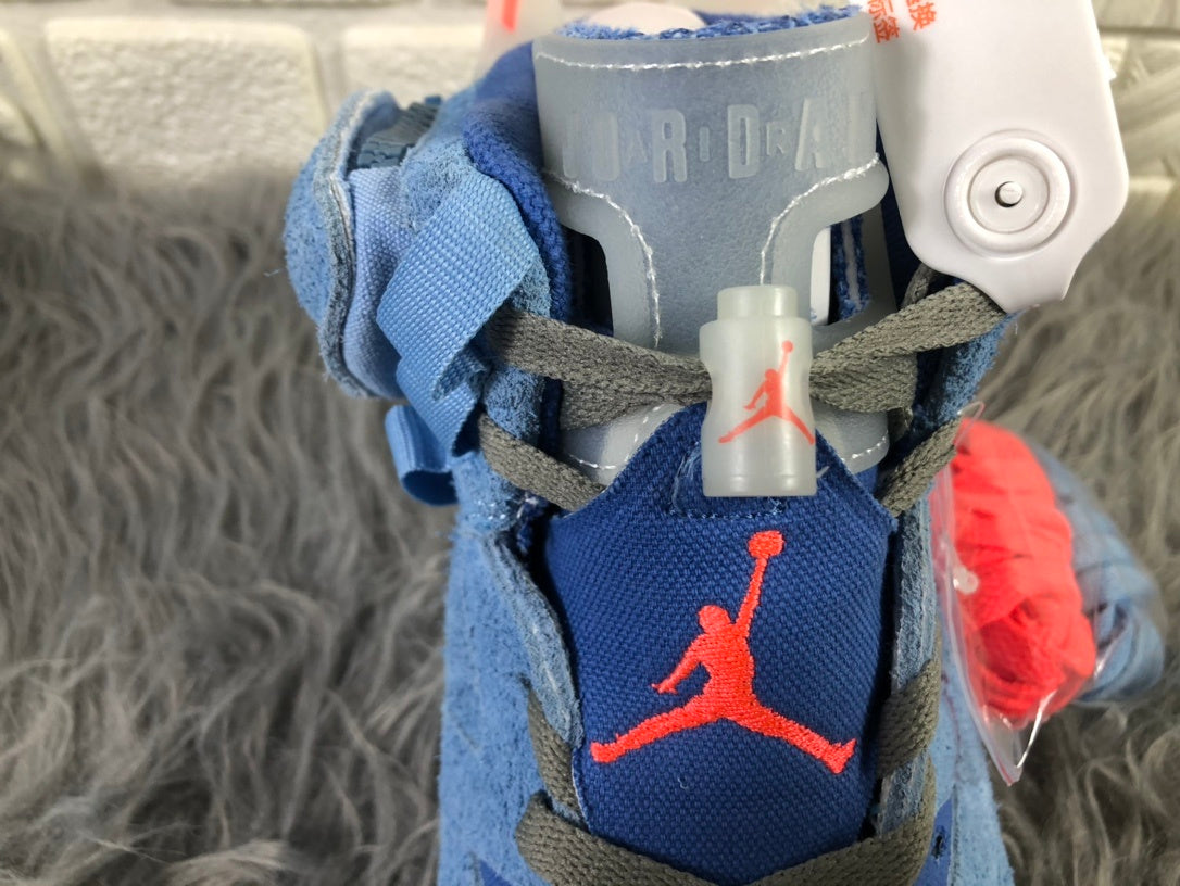 Close-up of the tongue showing Jordan branding, dark laces, and red logo details.
