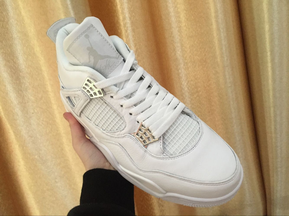 Angled top view showing the white laces, mesh panels, tongue, and layered toe construction.