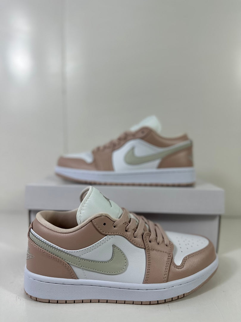 Close angled view of the low-top sneaker showing its lace area, perforated toe box, and side detailing.