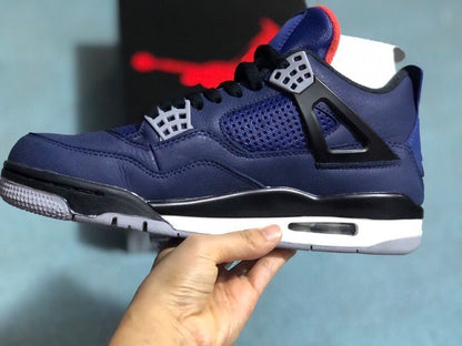 Side profile of a dark blue sneaker with black lace supports and a white midsole