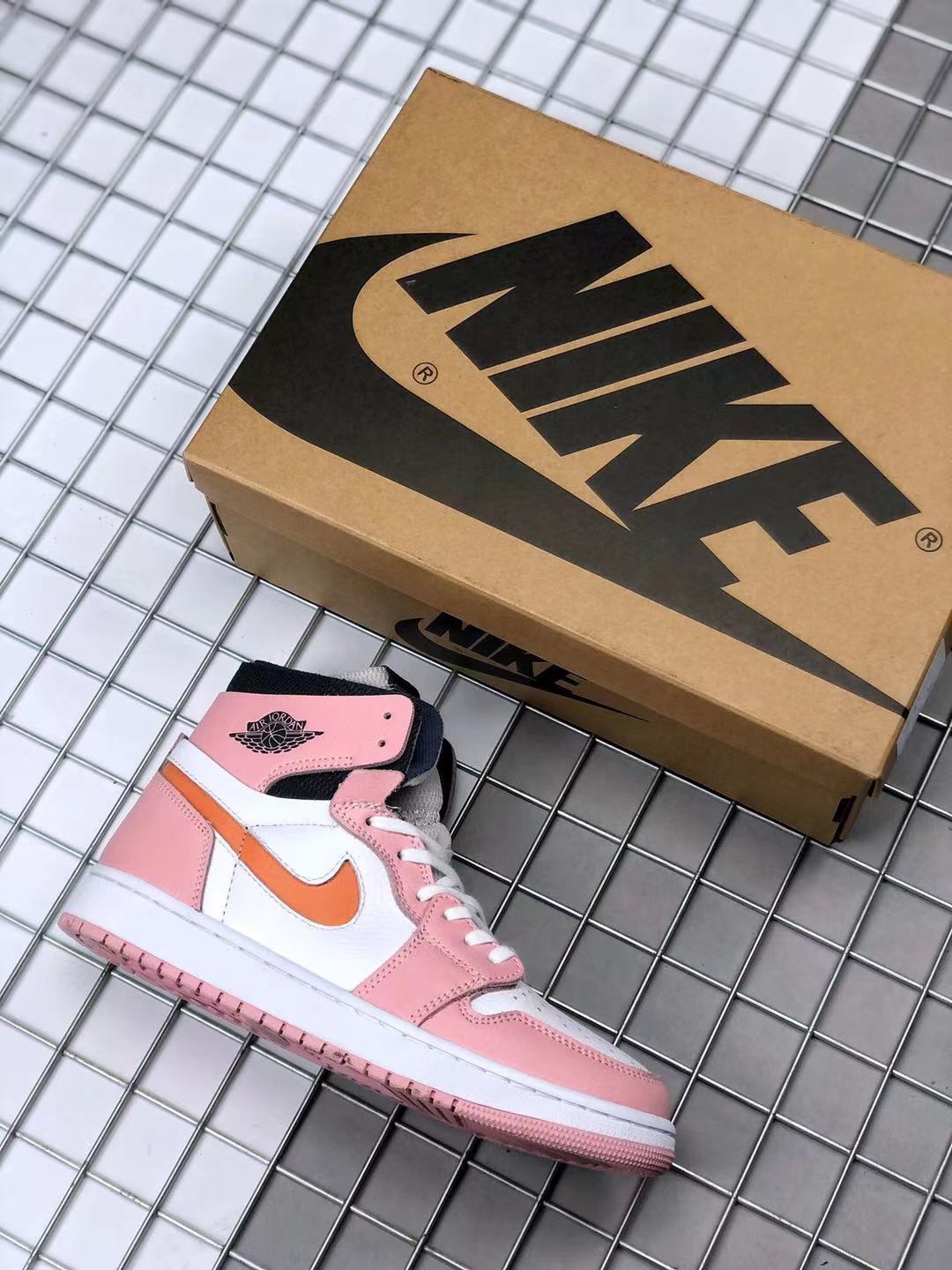 Pink, white, orange, and black high-top sneaker shown beside a branded shoe box.