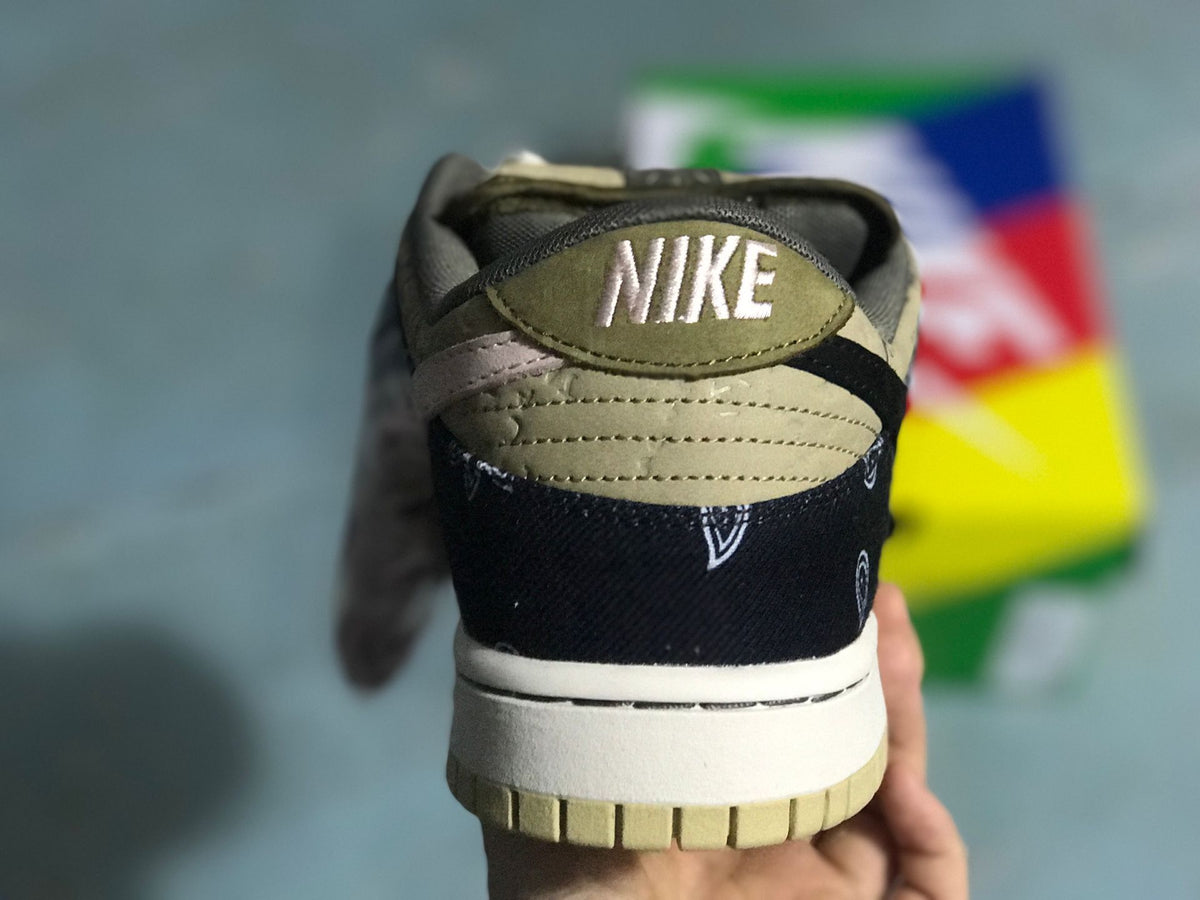 Rear view of the sneaker showing the embroidered Nike heel detail and layered heel construction.