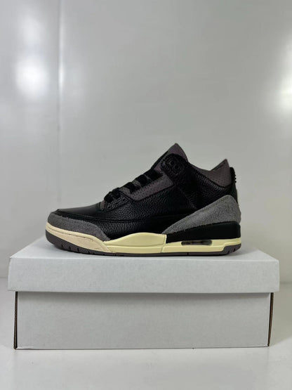 Side profile showing the black upper, gray heel and toe overlays, cream midsole, and heel cushioning window.