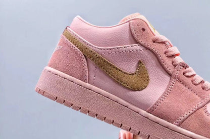 Close-up of the side profile showing pink panels, stitching and gold branding.