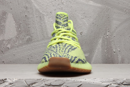 Front view showing the woven patterned upper, matching laces, and rounded toe.