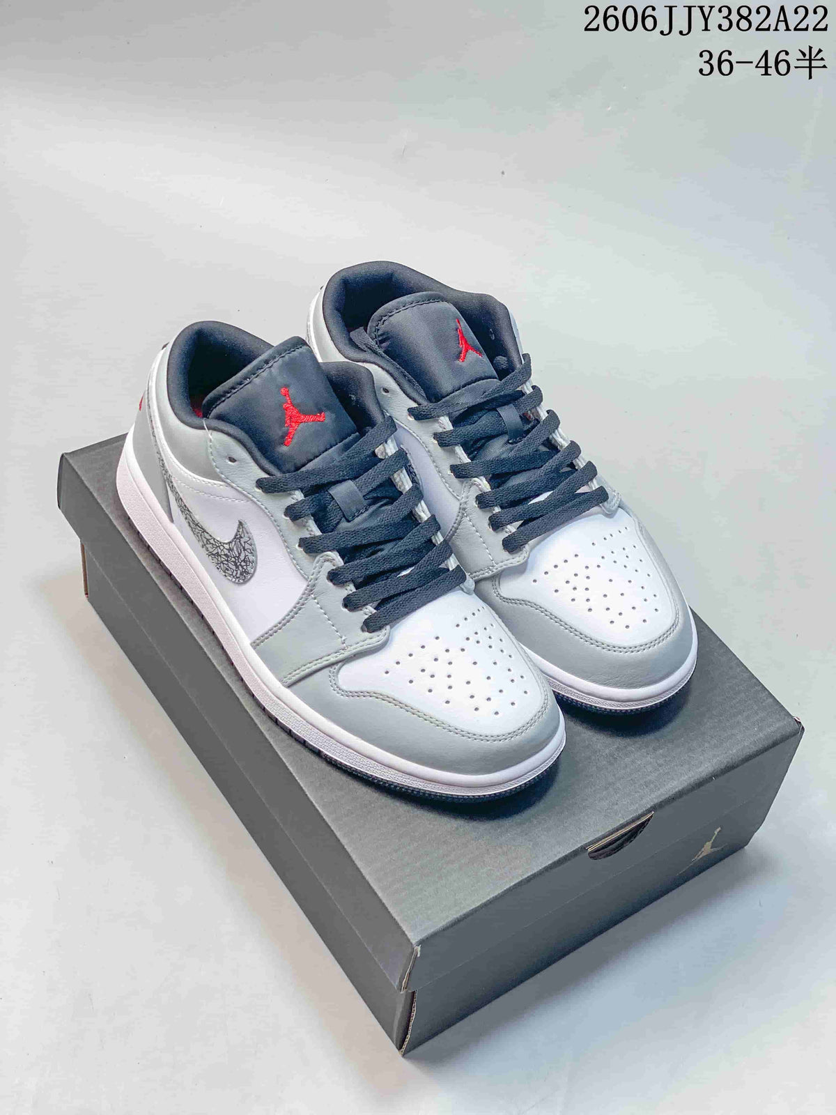 Jordan Air Jordan 1 Low Sneakers in White and Grey