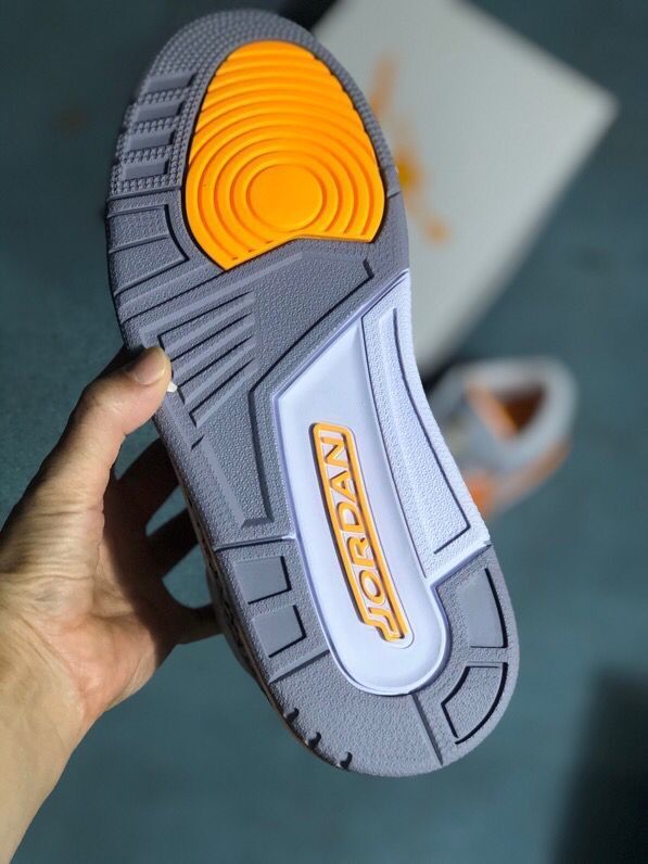 Outsole view showing gray and orange tread and Jordan branding.
