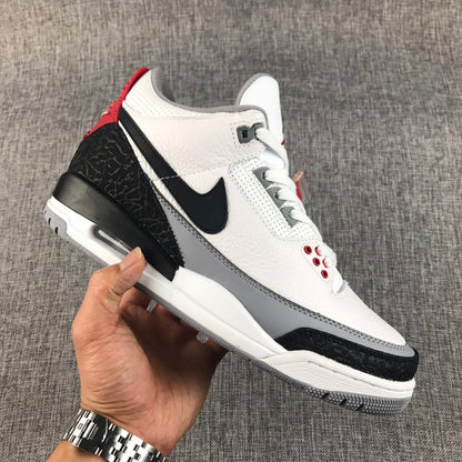 Side view showing the white upper, black Swoosh, grey midsole section, elephant-print overlays, and air window.