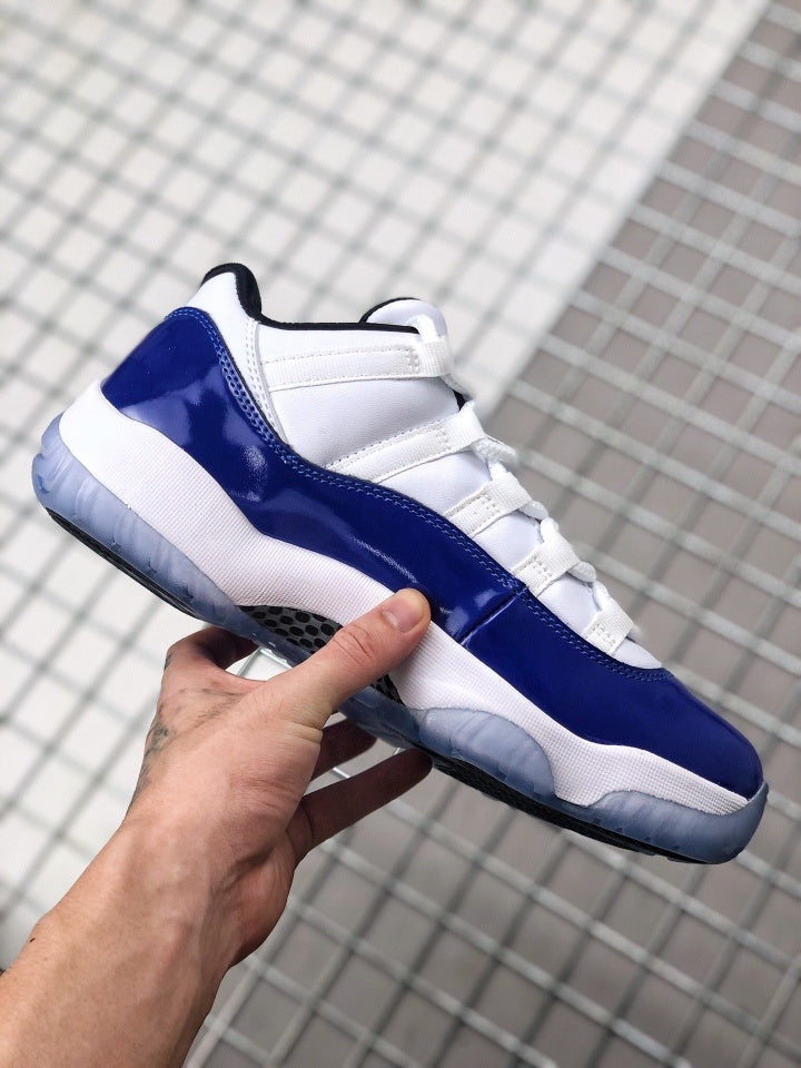 Side profile showing the blue and white upper, white midsole, and translucent outsole.