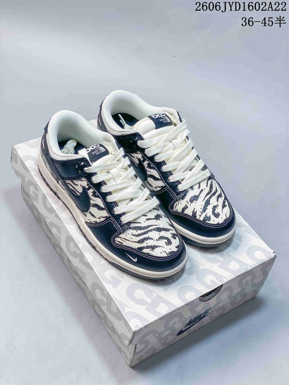 Nike SB Dunk Low Striped Cream and Navy Sneakers